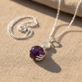 Amethyst Healing Hands Pendant - linen background